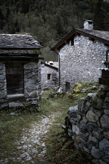 Exploring a small village of mountain houses in Mello Valley, Northern Italy