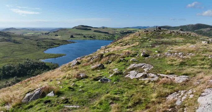 Aerial landscape footage of a lake in a valley in Algard, Norway