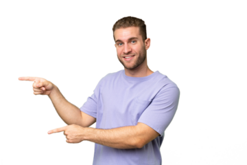 Young handsome caucasian man isolated on green chroma background pointing finger to the side and presenting a product