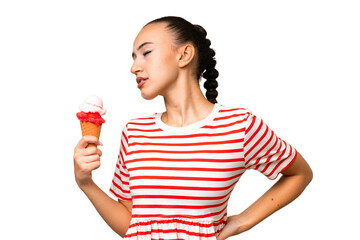 Young Arab woman with a cornet ice cream over isolated background suffering from backache for having made an effort