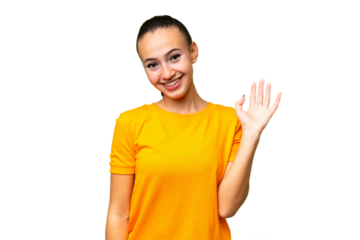 Young Arab woman over isolated background saluting with hand with happy expression