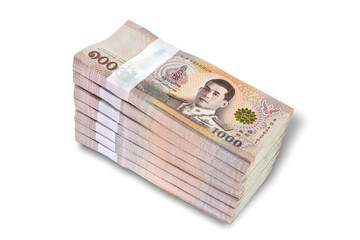 Thai baht, paper bank, price of one thousand, 100 per tie, stacked 7 sets isolated on white background. This has clipping path.