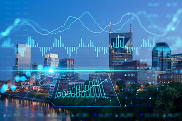 Panoramic view of Broadway district of Nashville over the river at illuminated night skyline, Tennessee, USA. Forex candlestick graph hologram. The concept of internet trading, brokerage and analysis