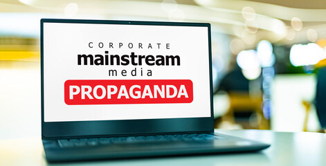 A computer displaying the watchword: mainstream media propaganda
