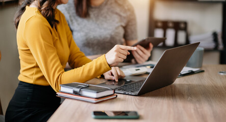 Fototapeta premium Business team meeting present.professional investor working with Finance managers task. with laptop smart phone and digital tablet in morning light.