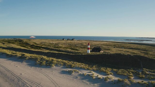 Sylt, Lighthouse Ellenbogen, Northernmost point of Germany. Schleswig-Holstein, North Sea. 4K drone. Beautiful tourist destination and attraction from above.
