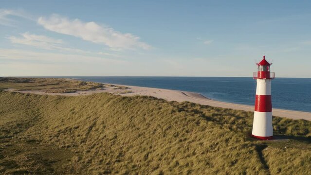 Sylt, Lighthouse Ellenbogen, Northernmost point of Germany. Schleswig-Holstein, North Sea. 4K drone. Beautiful tourist destination and attraction from above.