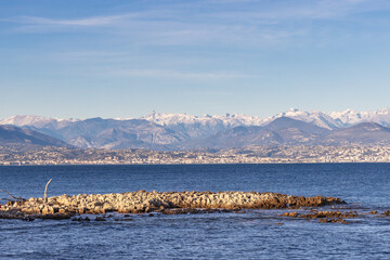 Côte d'Azur with snow covered Alpes Maritimes