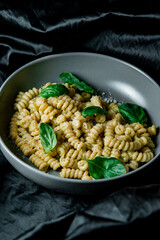 Classic homemade pasta with egg, hard parmesan cheese and cream sauce. Italian cuisine on black background