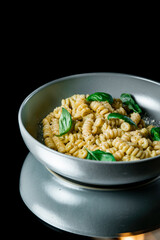 Classic homemade pasta with egg, hard parmesan cheese and cream sauce. Italian cuisine on black background