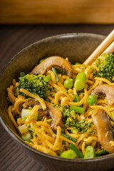 egg noodles with broccoli mushrooms and pea