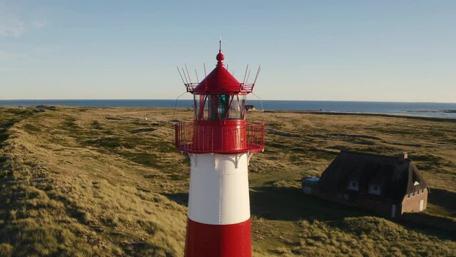 Sylt, Lighthouse Ellenbogen, Northernmost point of Germany. Schleswig-Holstein, North Sea. 4K drone. Beautiful tourist destination and attraction from above.