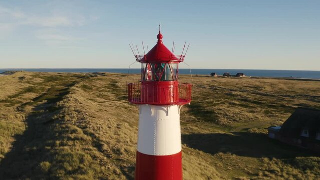 Sylt, Lighthouse Ellenbogen, Northernmost point of Germany. Schleswig-Holstein, North Sea. 4K drone. Beautiful tourist destination and attraction from above.