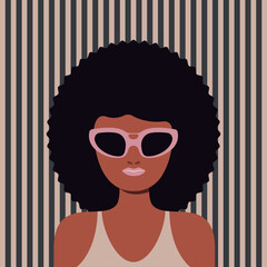 Portrait of a beautiful woman in sunglasses on a striped background.