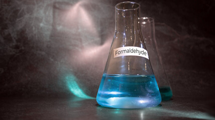 Focus of formaldehyde 37% CH2O chemical compound in glass flask inside a chemistry laboratory with...