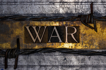 War text with barbed wire on grunge textured copper and gold background