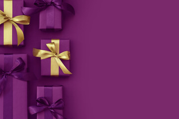 Gift boxes with purple and golden ribbon. Black Friday banner.