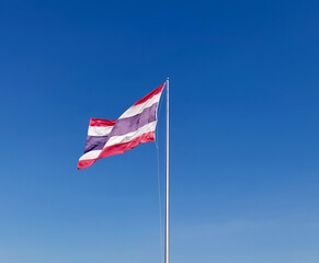 Thai flag on a blue sky background