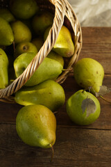 Pears on a wooden background. Fruit harvest. Autumn still life. Pear variety Bera Conference.