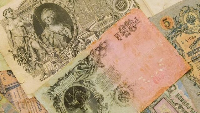 Old paper money of the Russian Empire of the 19th century. Retro banknote of Russian empire. Сlose-up of old banknotes of the tsarist Russian empire rotating. Antiques money, royal rubles rotate