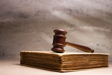 Law and justice concept. Mallet gavel of the judge, scales of justice, books. Copy space for text