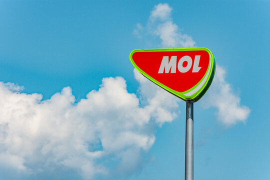 Cluj-Napoca, Romania - JUN 22, 2021: Mol Company logo banner on a pillar against blue sky with clouds