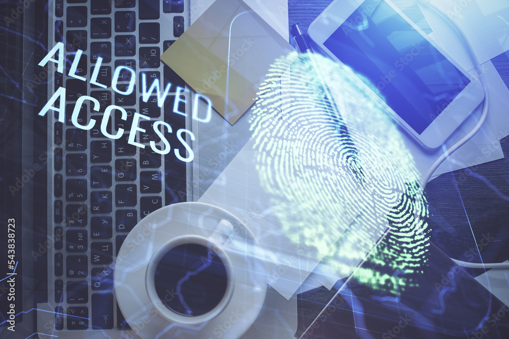 Poster Finger print over computer on the desktop background. Top view. Double exposure. Concept of securitization.