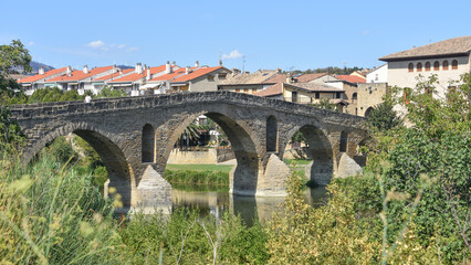 Fototapeta premium Puente la Reina, Spain - 31 Aug, 2022: Arches of the roman Puente la Reina foot bridge, Navarre, Spain