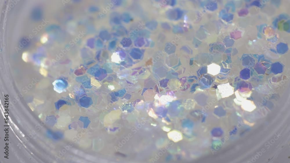 Poster decorative sequins in a jar rotate in a circle