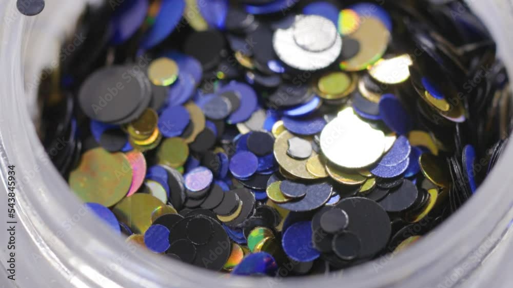 Poster purple sequins in a jar rotate in a circle