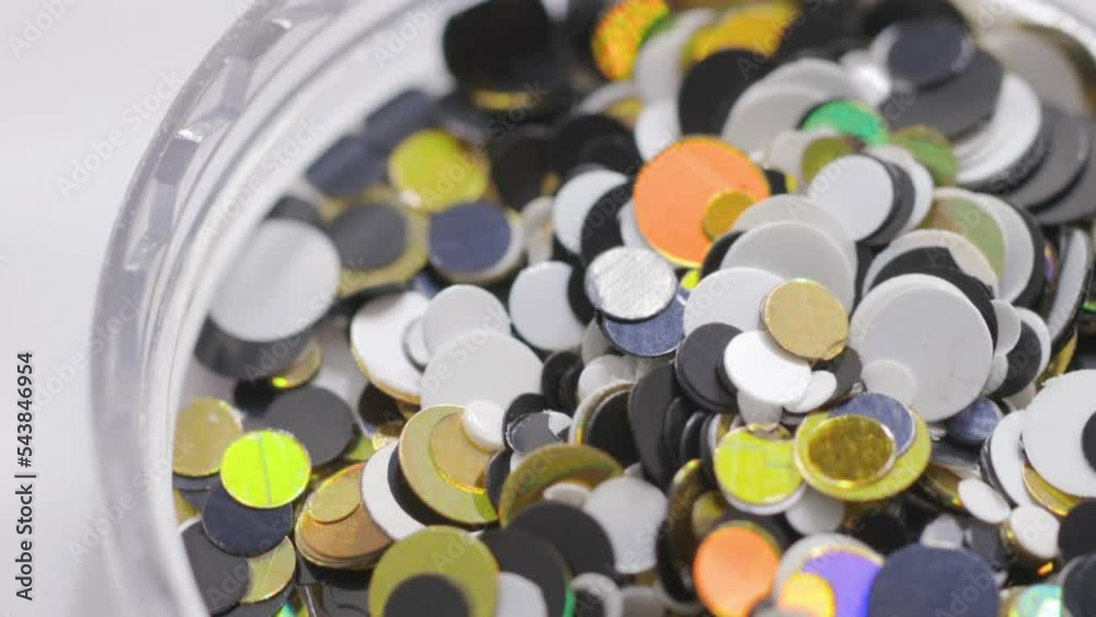 Poster decorative sequins in a jar rotate in a circle