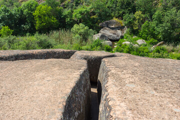 A narrow passage between two large stones in  Arbuzynsky canyon near the Trykraty village, on the Arbuzynka river in the Voznesenskyi region of Mykolaiv Oblast of Ukraine