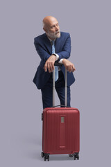 Businessman traveling with a trolley bag