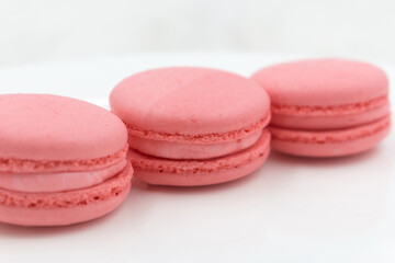Delicious sweet light macaron dessert. Round strawberry pie.