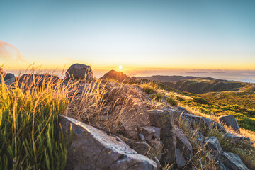 Tourists watching the sunrise over the beautiful mountain landscape of Pico do Ariero. Pico do...