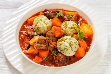 Beef Stew with Dumplings in bowl, top view