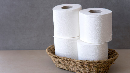 rolls of toilet paper on grunge background
