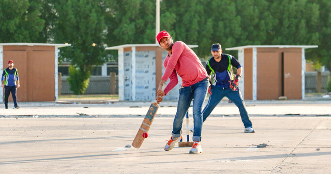 local people playing cricket sport