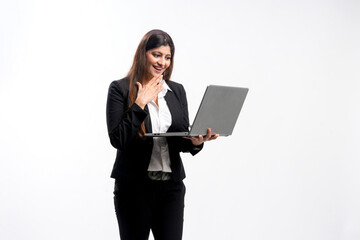 Indian businesswoman or employee using laptop on white background.