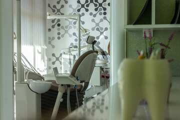 dentist office with dentist equipment and teeth mold