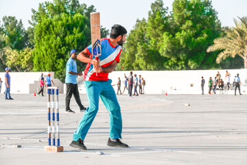 local people playing cricket sport