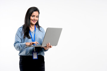 Indian businesswoman or employee using laptop on white background.