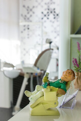 dentist office with dentist equipment and teeth mold