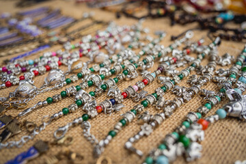 Many colorful bracelets from handcraft souvenirs shop