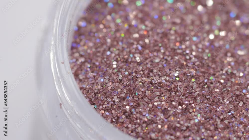 Poster decorative sequins in a jar rotate in a circle