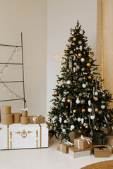 Christmas gifts under the tree. Beautiful boxes with New Year's gifts in a white interior.