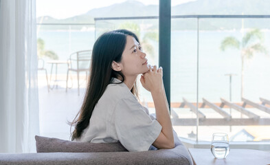 woman sitting on sofa