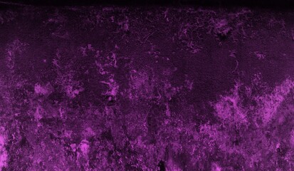 A textured purple concrete wall with a prominent vertical crack.