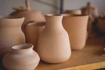 Fototapeta na wymiar Ceramic vase on the table at the workshop