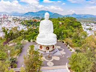 A white Buddha on a lotus flower.  Lang Son Pagoda (Chùa Long Sơn) is the main Buddhist temple of...